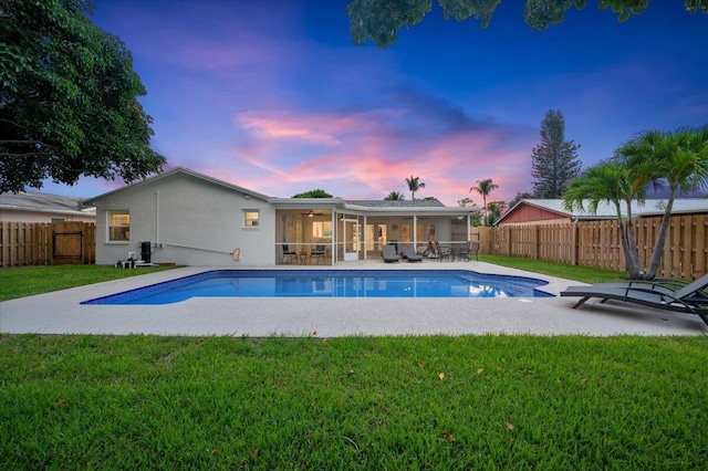 509 Oak Ter, Jupiter, FL 33458 - view of pool featuring a yard, a fenced in pool, a fenced backyard, and ceiling fan