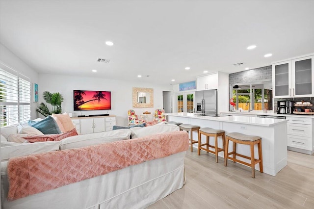 509 Oak Ter, Jupiter, FL 33458 - living area featuring recessed lighting, a wealth of natural light, and visible vents