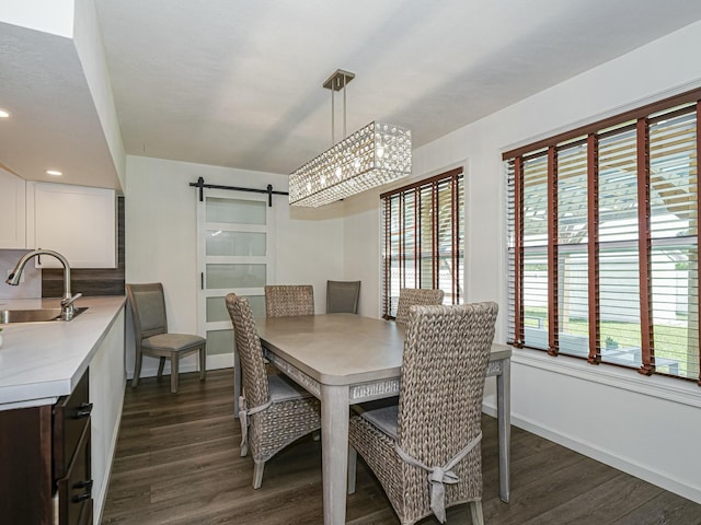 1732 Sunrise Ln, Sebastian, FL 32958 - dining room with a barn door, an inviting chandelier, dark wood finished floors, baseboards, and recessed lighting