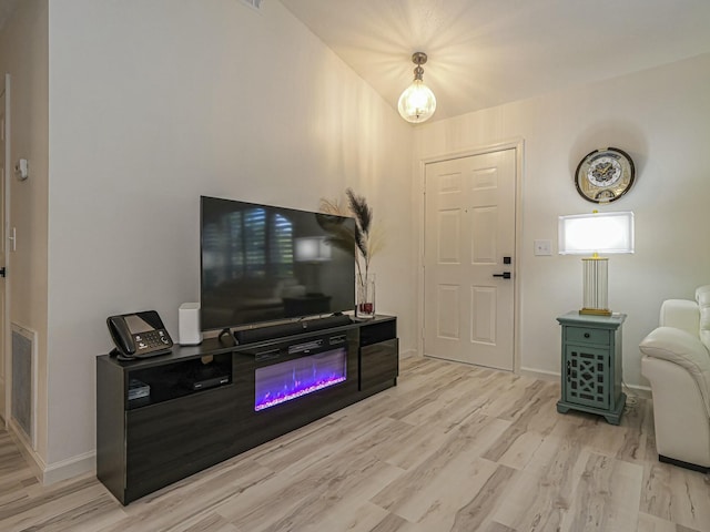 1732 Sunrise Ln, Sebastian, FL 32958 - living area with baseboards, wood finished floors, and visible vents