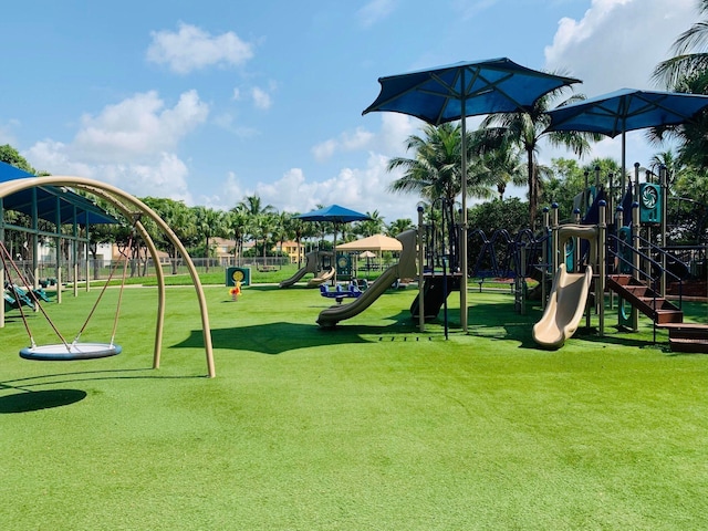 community play area featuring a lawn