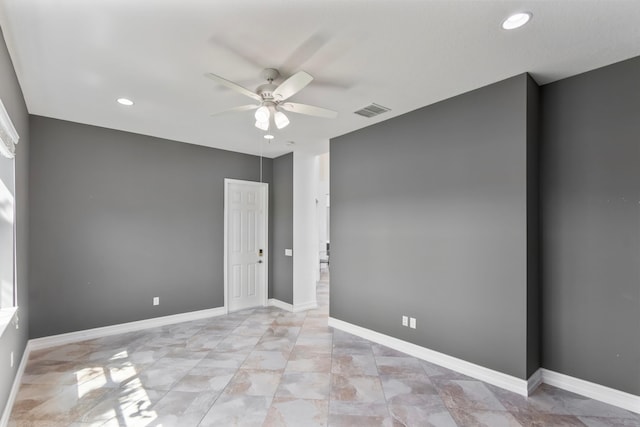 unfurnished room featuring visible vents, a ceiling fan, recessed lighting, and baseboards
