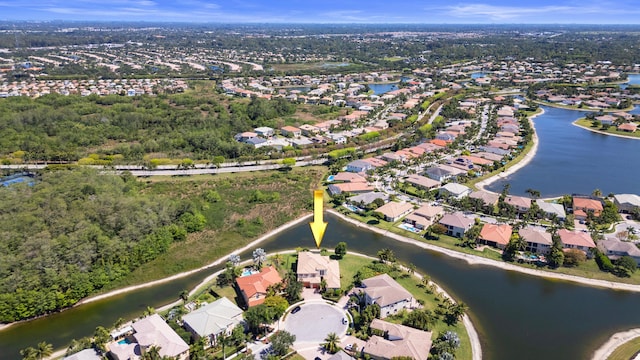 birds eye view of property featuring a water view and a residential view