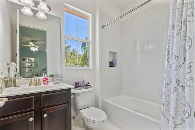 bathroom featuring toilet, shower / bath combo with shower curtain, vanity, and a ceiling fan