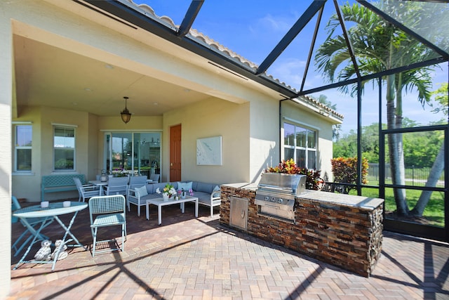 view of patio featuring outdoor lounge area, area for grilling, a grill, and a lanai