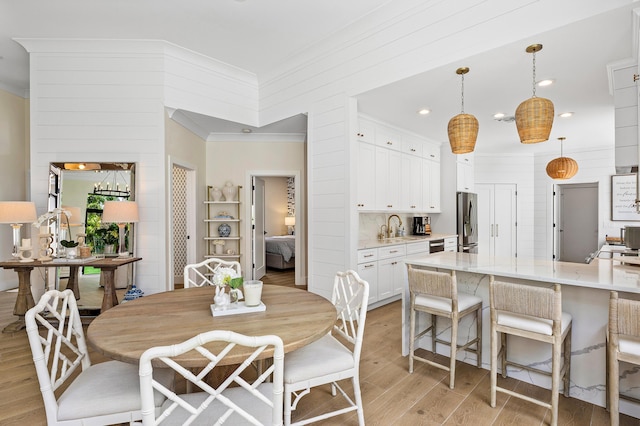 2441 NW 64th St, Boca Raton, FL 33496 - dining space featuring recessed lighting, light wood-type flooring, and crown molding