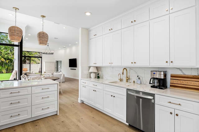 2441 NW 64th St, Boca Raton, FL 33496 - kitchen with white cabinets, stainless steel dishwasher, a sink, light wood-style floors, and decorative backsplash