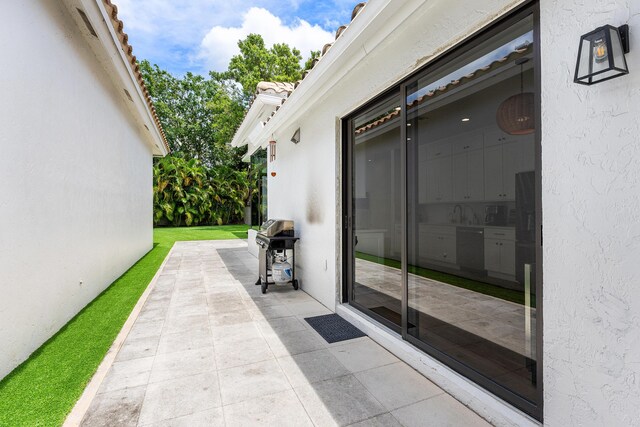2441 NW 64th St, Boca Raton, FL 33496 - view of patio / terrace featuring a grill