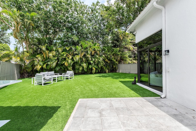 2441 NW 64th St, Boca Raton, FL 33496 - view of yard featuring a fenced backyard, a patio area, and an outdoor hangout area