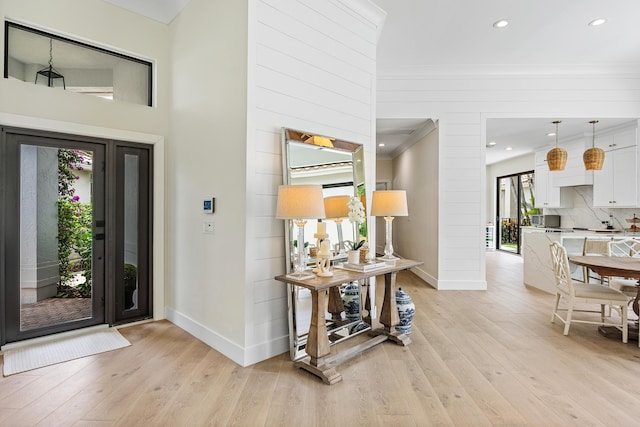 2441 NW 64th St, Boca Raton, FL 33496 - entrance foyer with light wood-type flooring, baseboards, recessed lighting, and crown molding