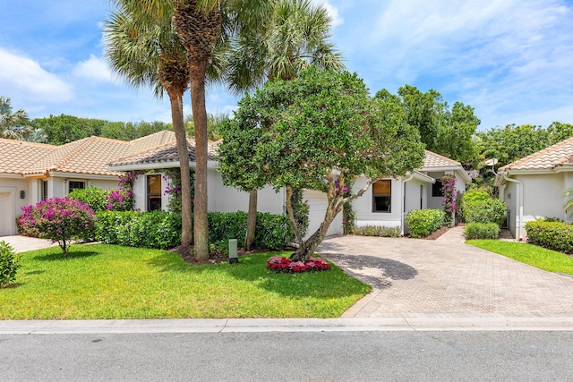 2441 NW 64th St, Boca Raton, FL 33496 - view of front of house featuring a tile roof and stucco siding