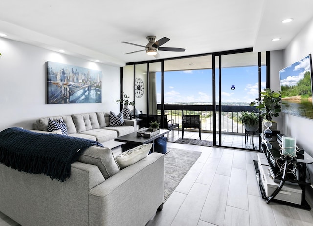 2400 Presidential Way Unit 1803, West Palm Beach, FL 33401 - living room with a wall of windows, ceiling fan, recessed lighting, and wood finished floors