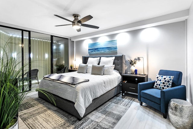 2400 Presidential Way Unit 1803, West Palm Beach, FL 33401 - bedroom featuring a ceiling fan and wood finished floors