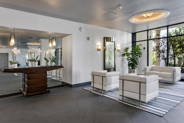 2400 Presidential Way Unit 1803, West Palm Beach, FL 33401 - common area with a wall of windows