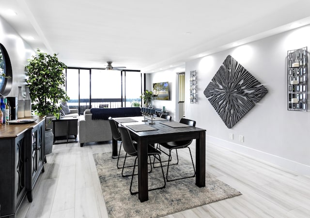 2400 Presidential Way Unit 1803, West Palm Beach, FL 33401 - dining area featuring ceiling fan, expansive windows, light wood-style flooring, recessed lighting, and baseboards