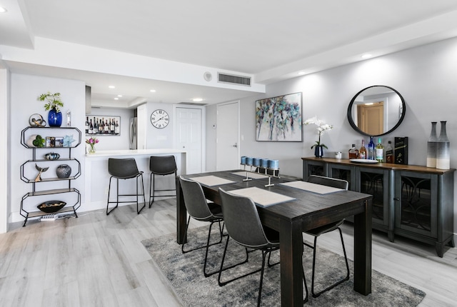 2400 Presidential Way Unit 1803, West Palm Beach, FL 33401 - dining area featuring a dry bar, recessed lighting, and light wood-style floors