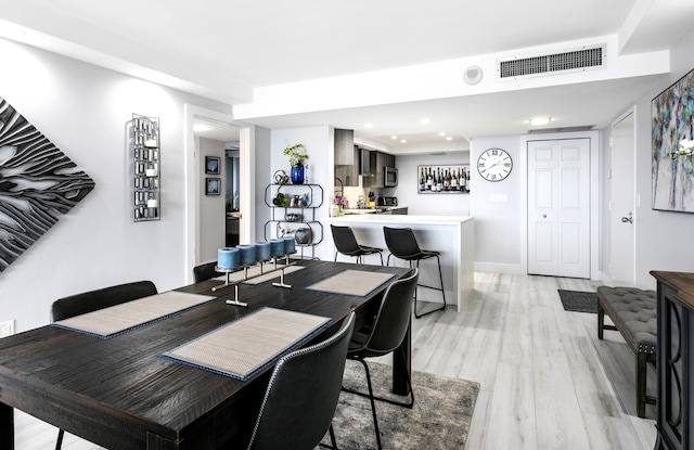 2400 Presidential Way Unit 1803, West Palm Beach, FL 33401 - dining room with light wood-type flooring and recessed lighting