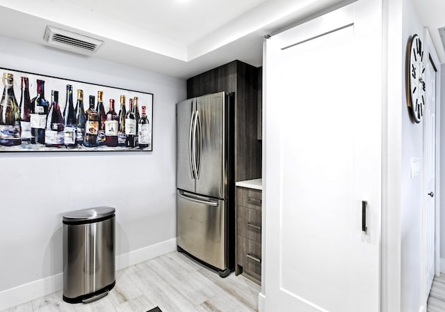 2400 Presidential Way Unit 1803, West Palm Beach, FL 33401 - kitchen featuring freestanding refrigerator, baseboards, and light countertops