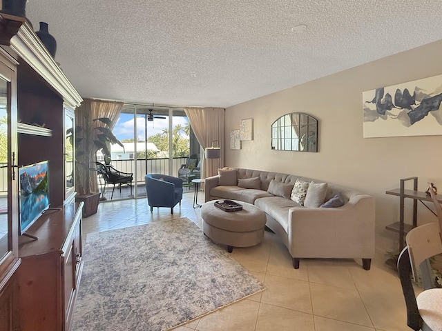 777 S Federal Hwy Unit 209N, Pompano Beach, FL 33062 - living room featuring light tile patterned floors and a textured ceiling