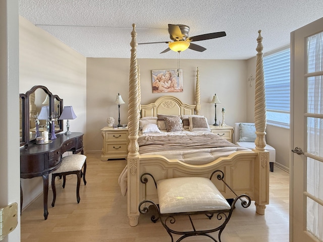 777 S Federal Hwy Unit 209N, Pompano Beach, FL 33062 - bedroom with baseboards, a ceiling fan, light wood-style floors, and a textured ceiling