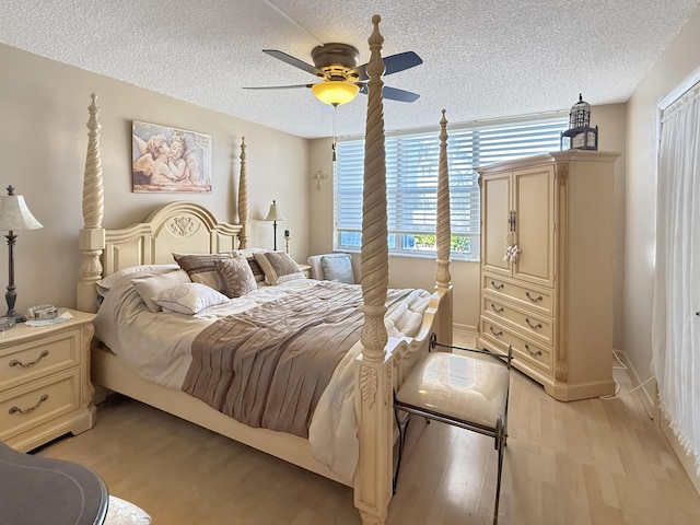 777 S Federal Hwy Unit 209N, Pompano Beach, FL 33062 - bedroom featuring light wood finished floors, a textured ceiling, ceiling fan, and baseboards
