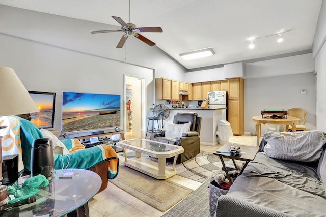 living room with a ceiling fan, light tile patterned floors, and high vaulted ceiling