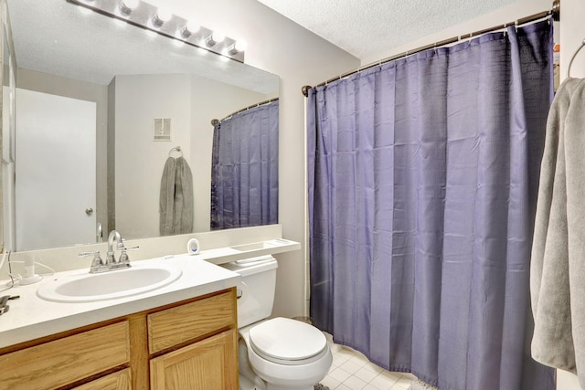 full bath featuring visible vents, vanity, toilet, a textured ceiling, and tile patterned floors