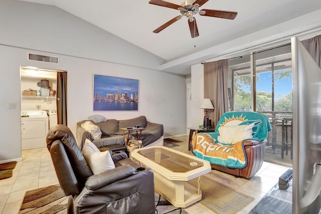 living room with visible vents, lofted ceiling, washing machine and dryer, a ceiling fan, and light tile patterned floors