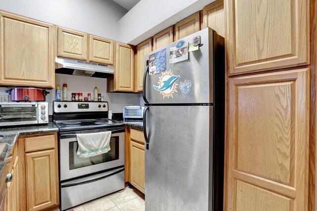 621 Lyons Rd Unit 9201, Coconut Creek, FL 33063 - kitchen featuring light brown cabinetry, a toaster, under cabinet range hood, appliances with stainless steel finishes, and light tile patterned flooring