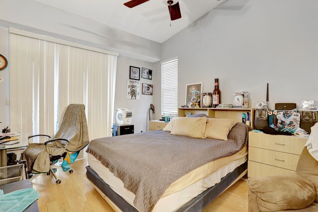 621 Lyons Rd Unit 9201, Coconut Creek, FL 33063 - bedroom with vaulted ceiling, ceiling fan, and wood finished floors