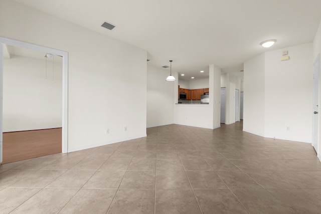 3030 Grandiflora Dr, Greenacres, FL 33467 - unfurnished living room with recessed lighting, visible vents, baseboards, and light tile patterned floors