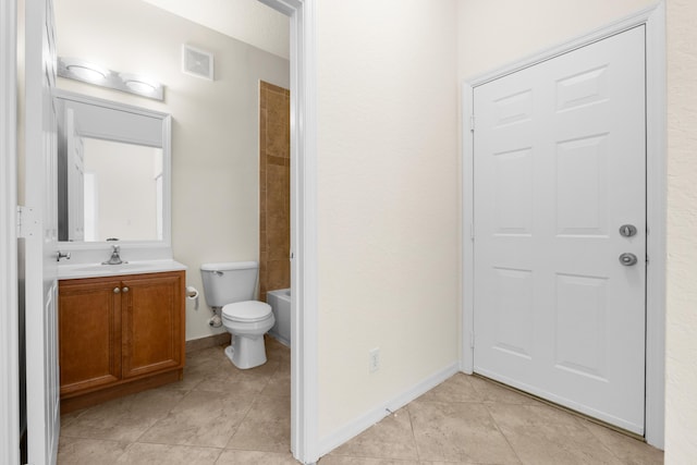 3030 Grandiflora Dr, Greenacres, FL 33467 - bathroom featuring tile patterned floors, toilet, visible vents, baseboards, and vanity