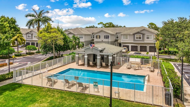 3030 Grandiflora Dr, Greenacres, FL 33467 - pool with fence, a patio area, and a residential view
