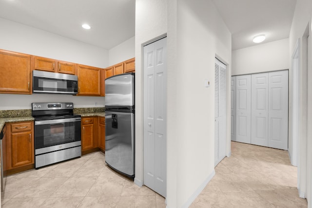 3030 Grandiflora Dr, Greenacres, FL 33467 - kitchen featuring brown cabinetry, recessed lighting, appliances with stainless steel finishes, and light tile patterned floors