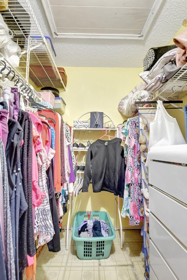 5325 Mariesa Ave, West Palm Beach, FL 33417 - spacious closet featuring tile patterned floors