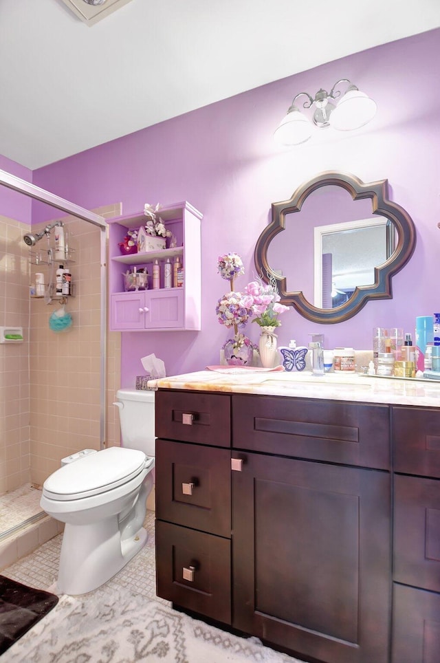 5325 Mariesa Ave, West Palm Beach, FL 33417 - bathroom with toilet, a shower stall, vanity, and tile patterned floors