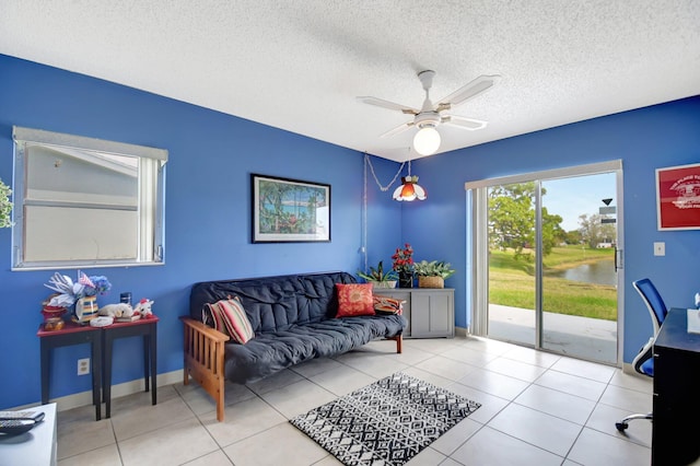 5325 Mariesa Ave, West Palm Beach, FL 33417 - tiled office space with ceiling fan, a textured ceiling, a water view, and baseboards