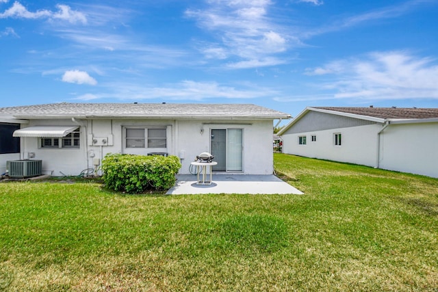 5325 Mariesa Ave, West Palm Beach, FL 33417 - back of property with a patio, a lawn, central air condition unit, and stucco siding