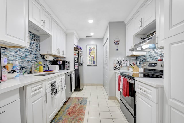 5325 Mariesa Ave, West Palm Beach, FL 33417 - kitchen featuring stainless steel appliances, a sink, white cabinets, light tile patterned floors, and recessed lighting