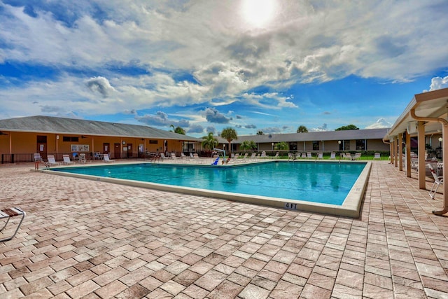 5325 Mariesa Ave, West Palm Beach, FL 33417 - community pool with a patio area and fence