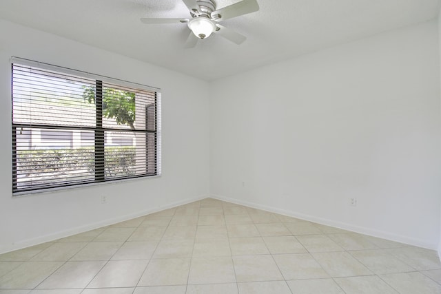 4221 W Mcnab Rd Unit 28, Pompano Beach, FL 33069 - empty room with light tile patterned flooring, baseboards, and ceiling fan