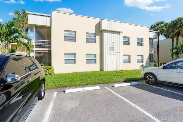 view of property with uncovered parking