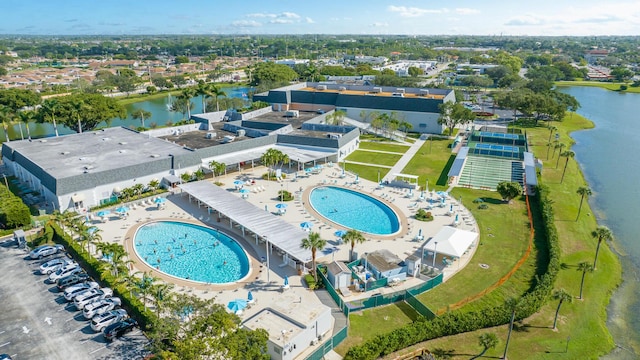 birds eye view of property featuring a water view