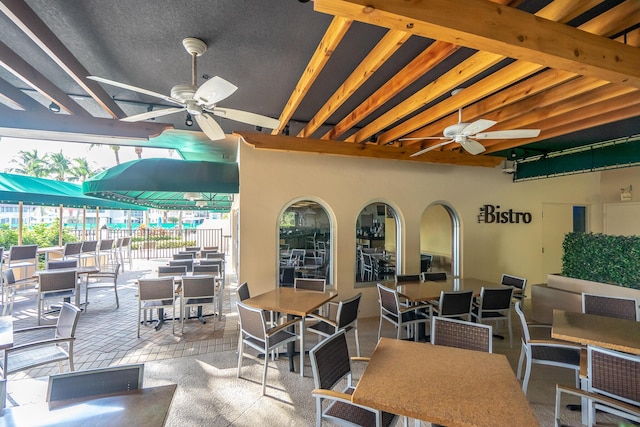 view of patio featuring a ceiling fan and outdoor dining space