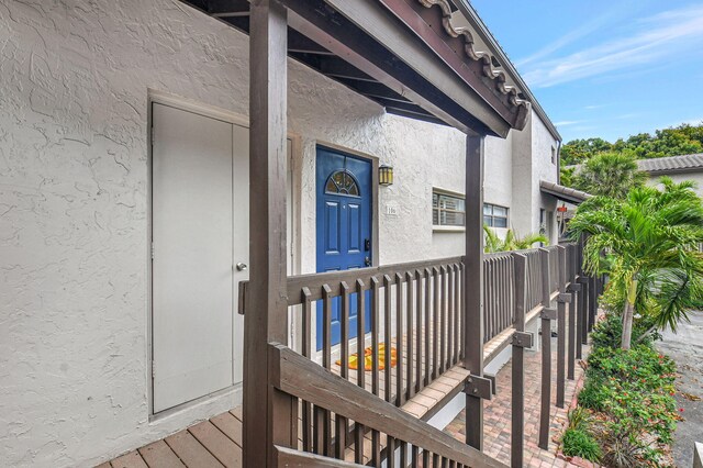 entrance to property featuring stucco siding