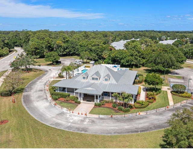 665 NE Bent Paddle Ln, Port Saint Lucie, FL 34983 - drone / aerial view with a view of trees