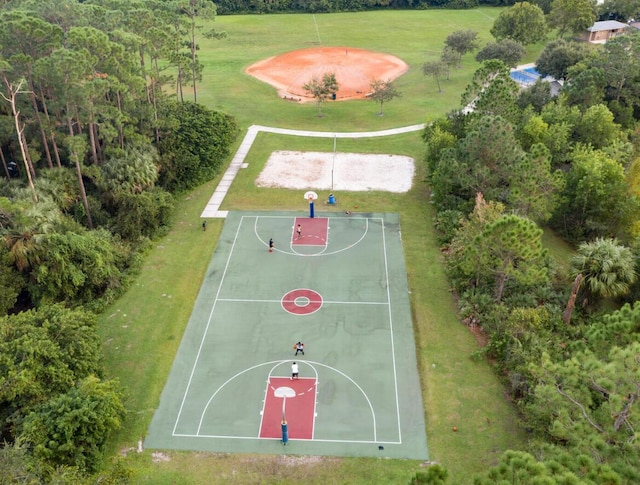 665 NE Bent Paddle Ln, Port Saint Lucie, FL 34983 - view of sport court with a yard and community basketball court