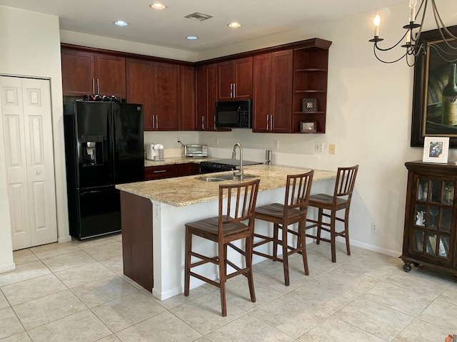 kitchen with open shelves, a sink, a peninsula, visible vents, and black appliances