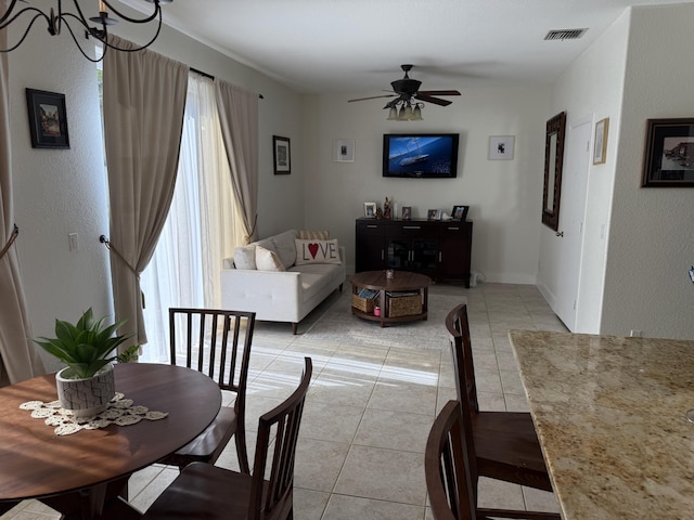 dining area with visible vents, ceiling fan, and light tile patterned flooring