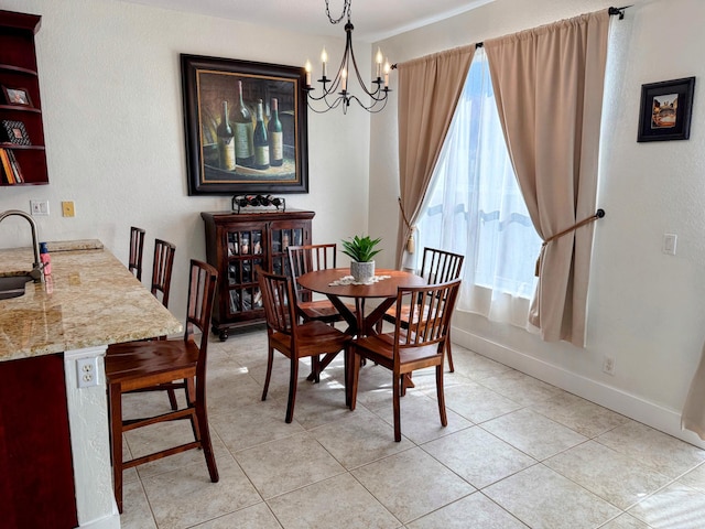 dining space featuring baseboards, an inviting chandelier, and light tile patterned floors